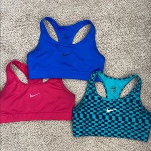 Group of 3 medium Nike sports bras.